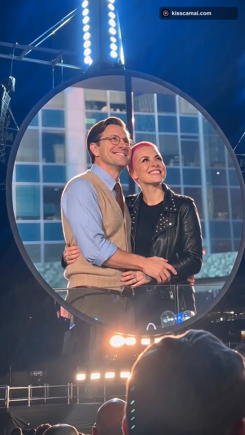 Kiss Cam AI frame: two people smiling on the jumbotron