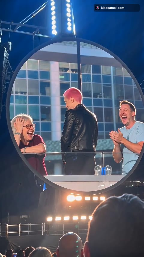 Kiss Cam AI frame: the crowd beside them laughing